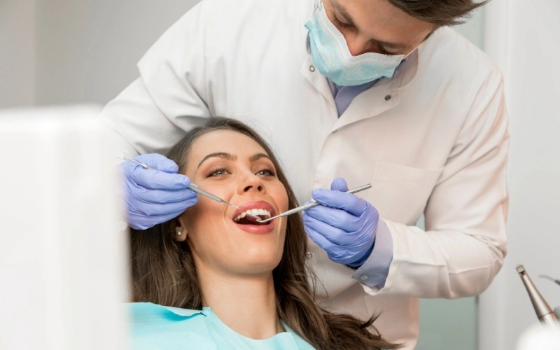 Professional dental treatment at Smile Studio Dental Dentist performing a dental procedure on an adult patient at Smile Studio Dental, Markham